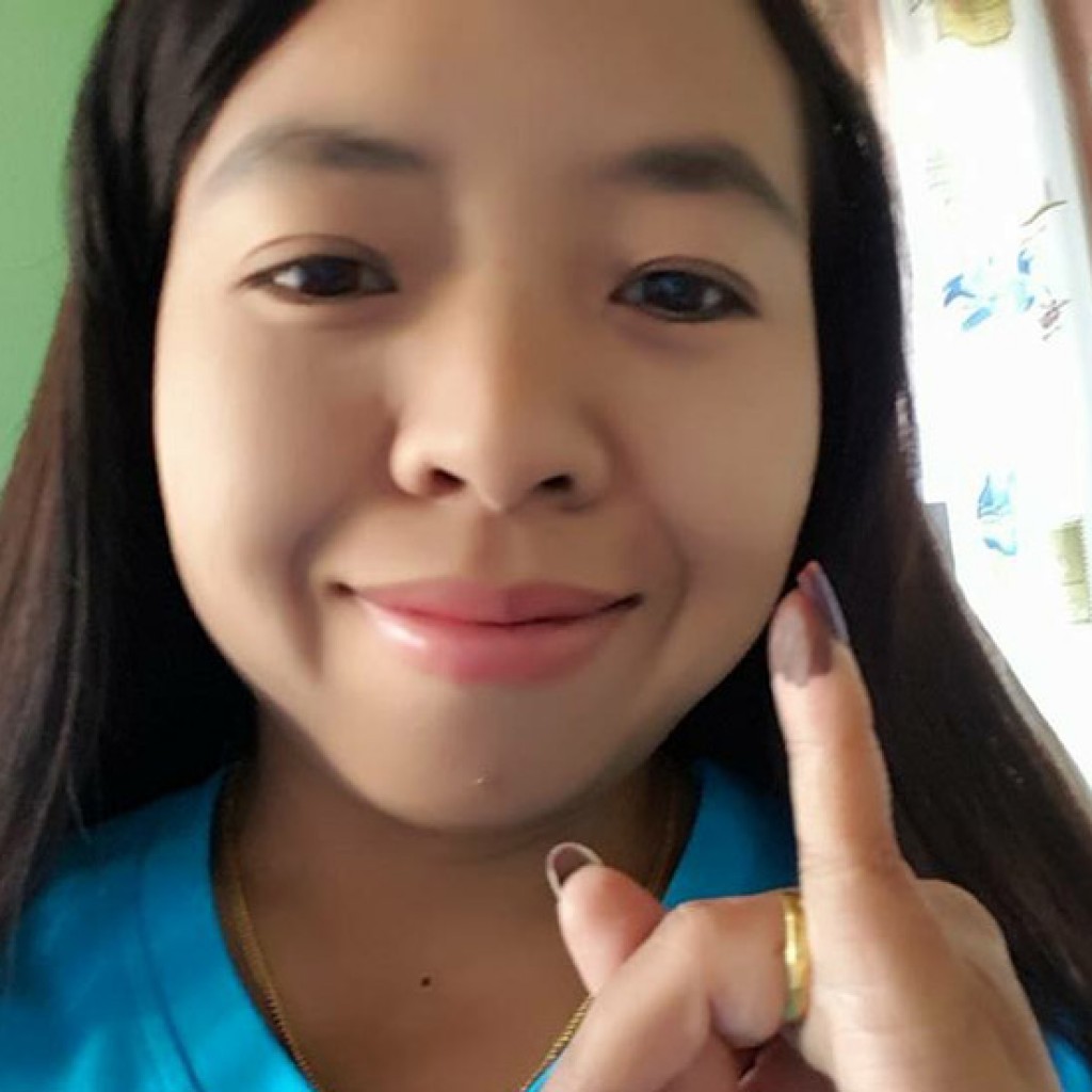 Selfie of Lway Moe Kham holding up her little finger.