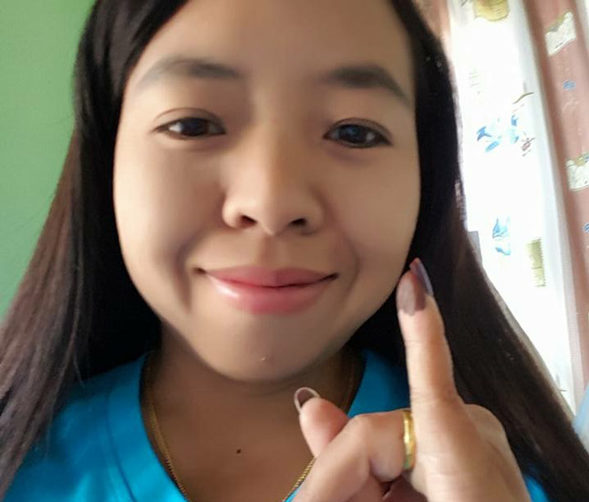 Selfie of Lway Moe Kham holding up her little finger.