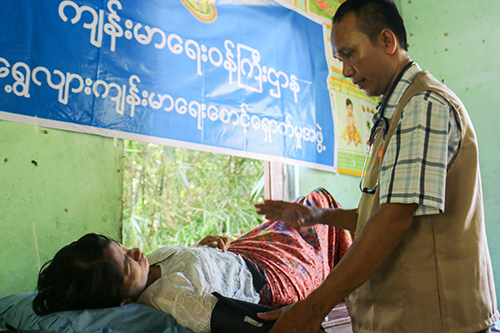 A women receives a dignity kit and a health check-up in Ayeyawady Region of Myanmar. Photo: Benny Manser/UNFPA