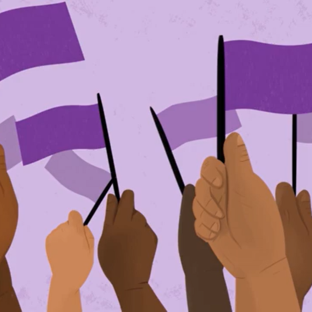 a group of hands waving purple flags