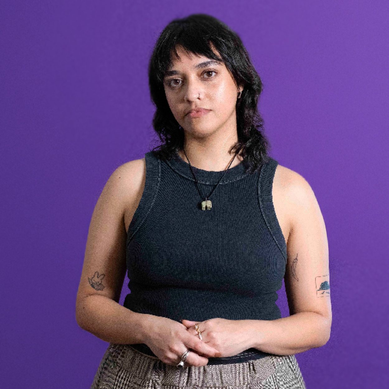 Young woman looks seriously at the camera