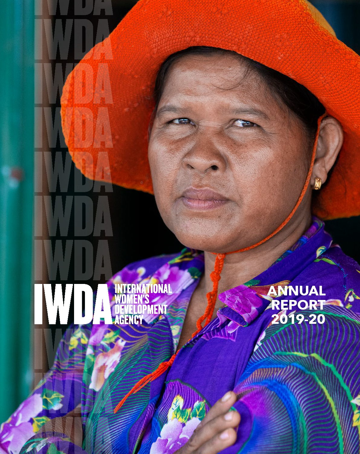 The header at the top of the page is white text on a purple background reading: Annual Report 2020-2021, alongside the IWDA's logo also in white text. Below the header is an image fills the rest of the page. It depicts women speaking into a megaphone at a rally in Myanmar.