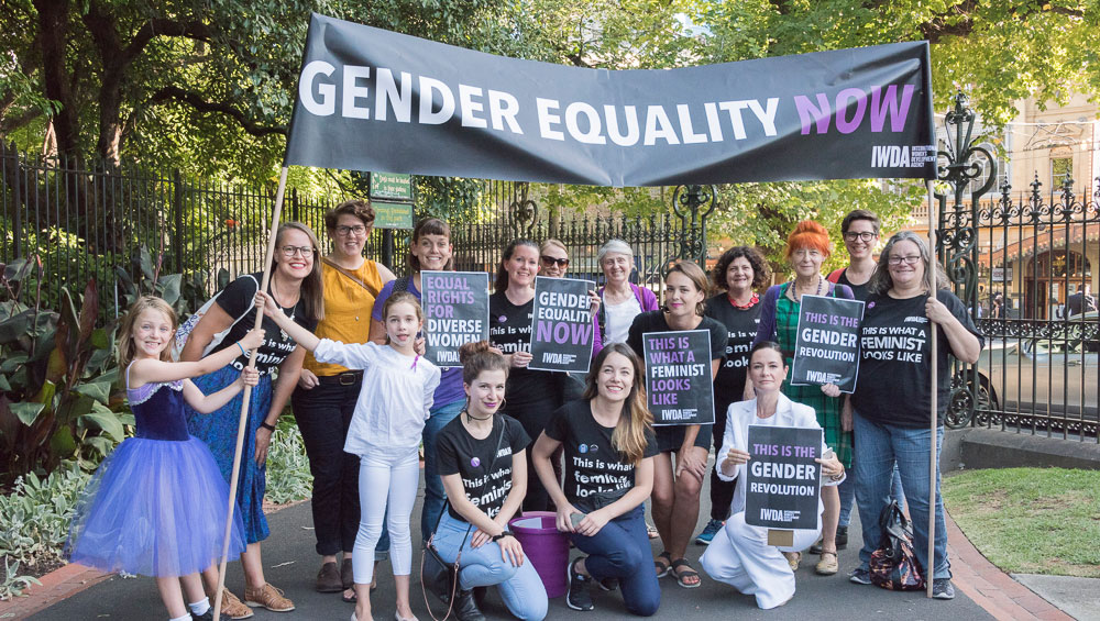 Women and girls stand together in support of Gender Equality