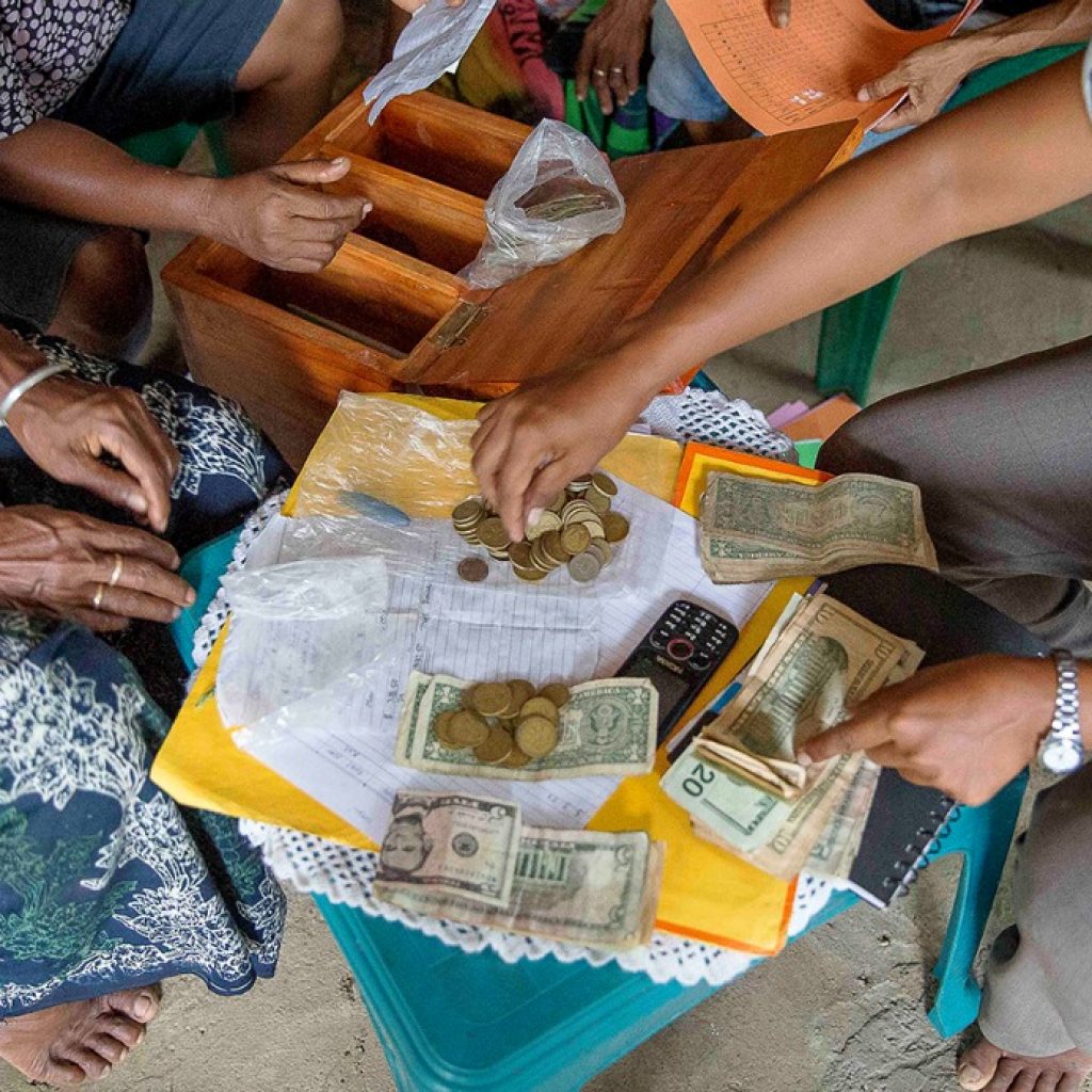 Image of women handling money in Timor Leste