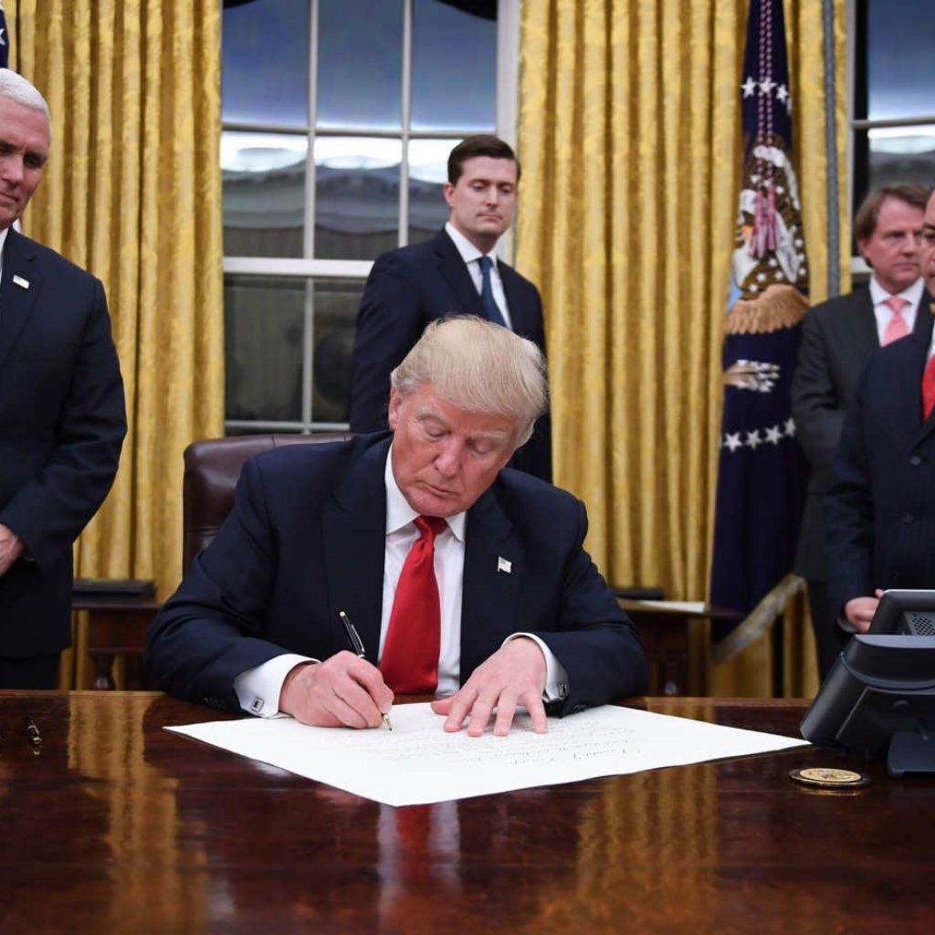 Donald Trump signs an Executive Order passing the Global Gag Rule.