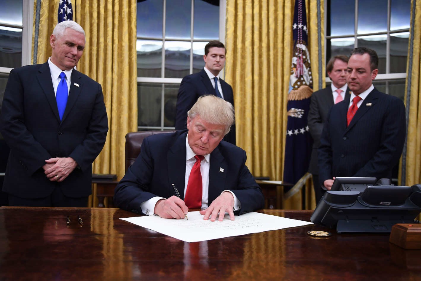 Donald Trump signs an Executive Order passing the Global Gag Rule.