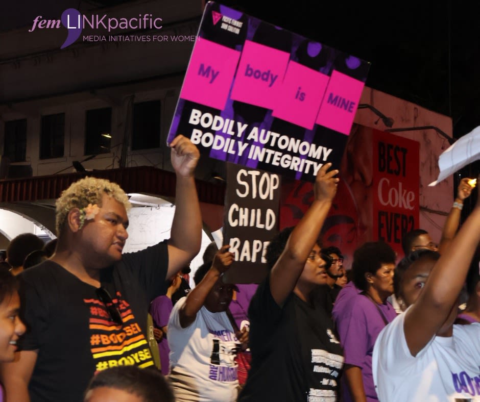People are holding up signs at the 'Reclaim the Night' march that read, 'My body is mine. Bodily autonomy. Bodily integrity.' and 'Stop child rape'. 