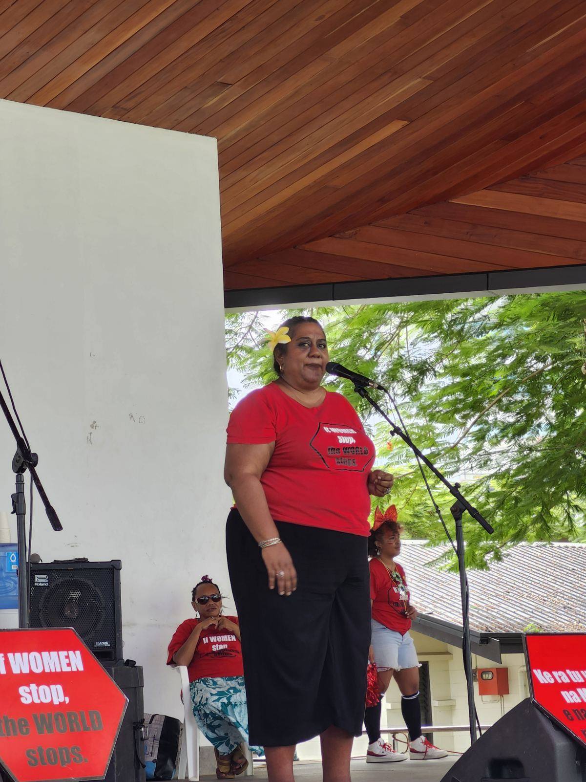 Nalini Singh, Executive Director of FWRM, is standing on stage as she addresses the crowd at the 'If Women Stop, the World Stops' concert.