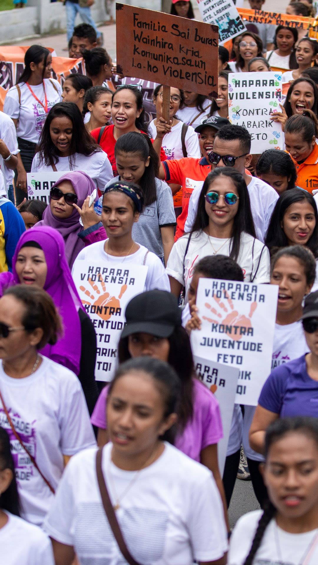 A crowd marching at an International Women's Day rally in Timor-Leste.