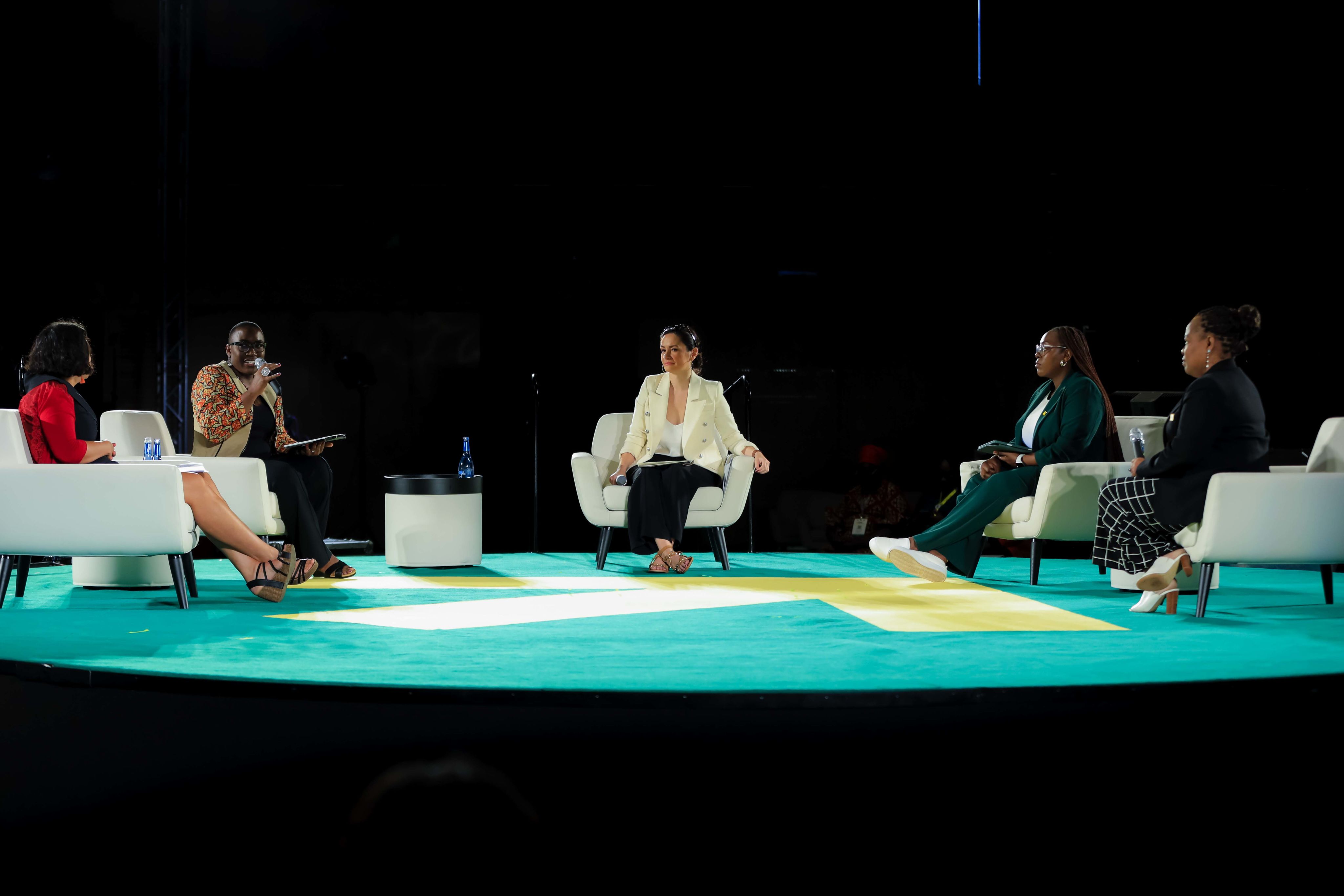Bettina on stage at the 2023 Women Deliver conference in Kigali surrounded by leaders from the women's rights movement.