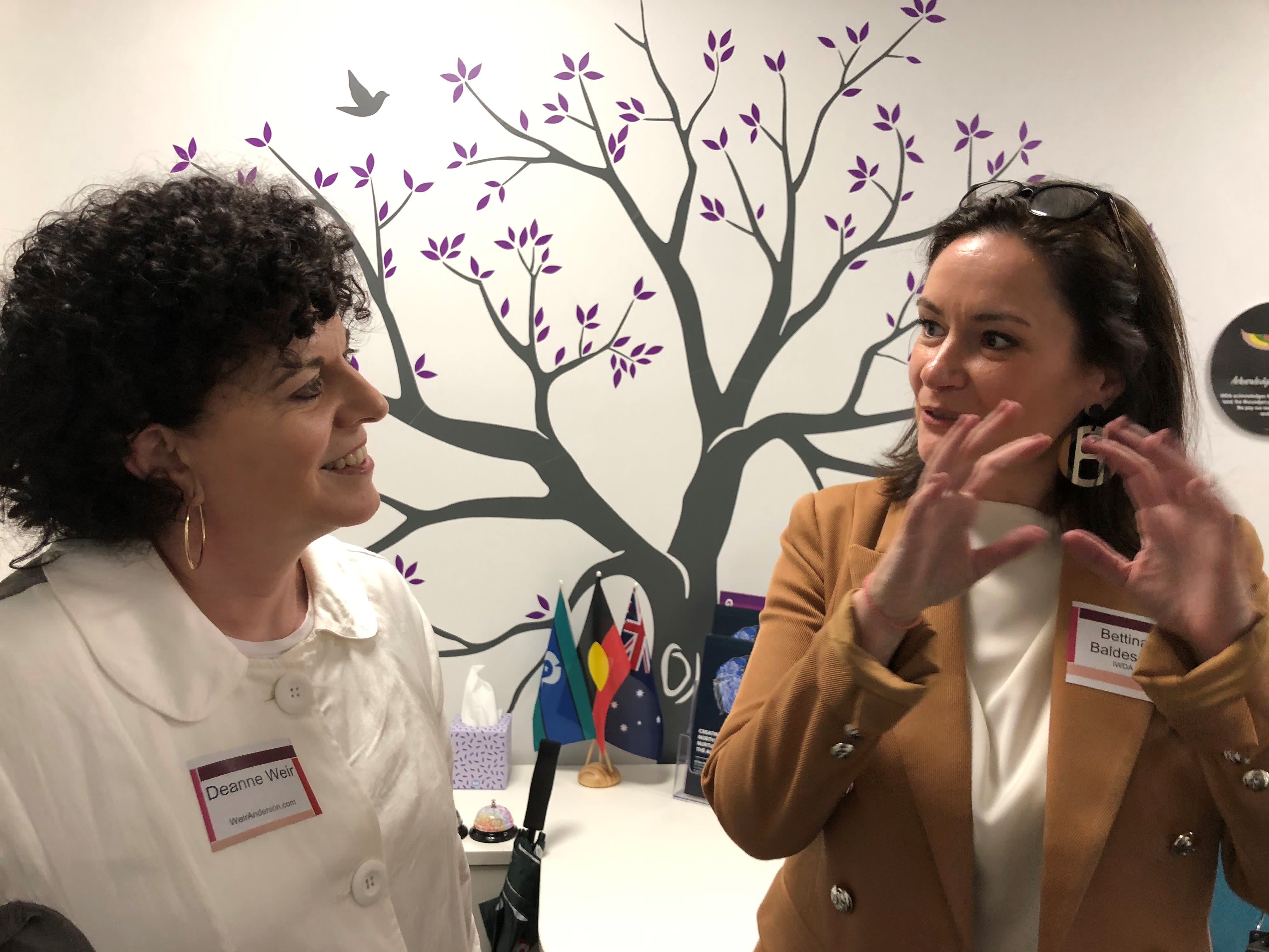 Bettina and Deanne Weir in conversation at the IWDA office.