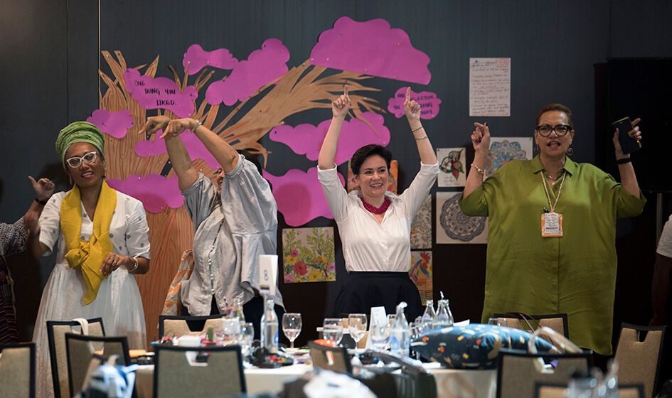 Bettina and feminist leaders Virisila Buadromo and Noelene Powell dancing together at Prospera conference.