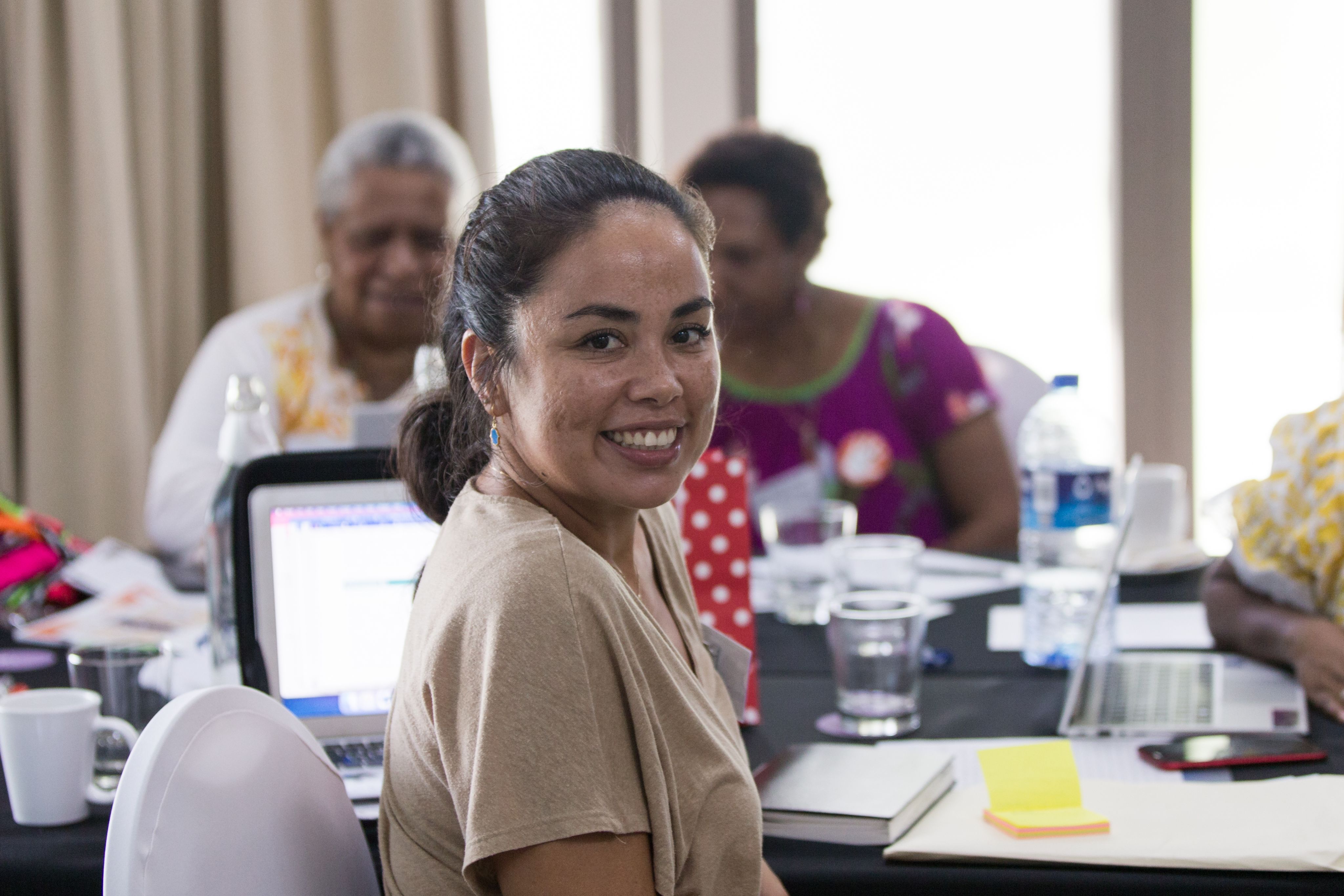 Yasmine from Sista is smiling at the camera as she poses for the photo.